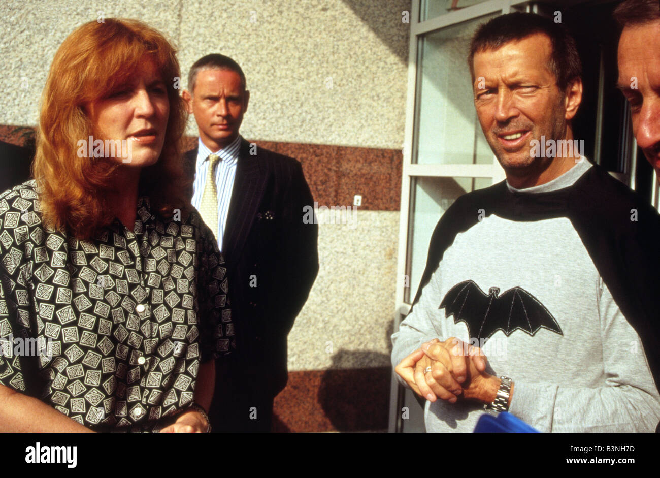 ERIC CLAPTON als Batman und Sarah Ferguson auf eine Charity-Auto-Rallye Stockfoto