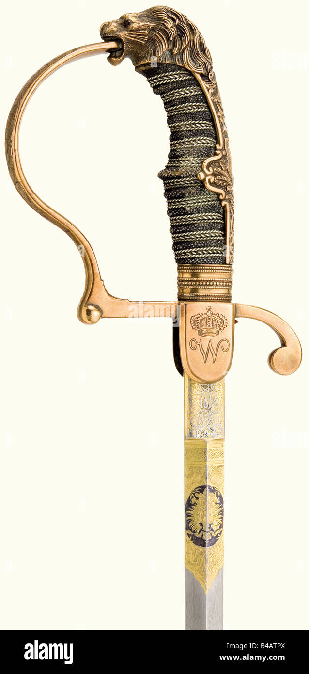 König Wilhelm II. (1848 - 1921) - ein Präsentationsschwert, Schwere, gerade, Damaszener Klinge, an der Basis fein geätzt und vergoldet, die obverse Seite mit dem kaiserlichen Wappen, die Rückseite mit "Eisenhauer-Damaststahl" beschriftet. Bläserknäuel mit eingravierten Schlieren, der obverse mit der Chiffre "W" unter einer Krone, der umgekehrte mit dem ebenfalls bekrönten württembergischen Wappen. Die Rückplatte ist reliefiert, der Knauf hat die Form eines Leopardenkopfes mit roten Glasaugen. Griffige Abdeckung mit dreifachem silberfarbenem Draht w, Stockfoto