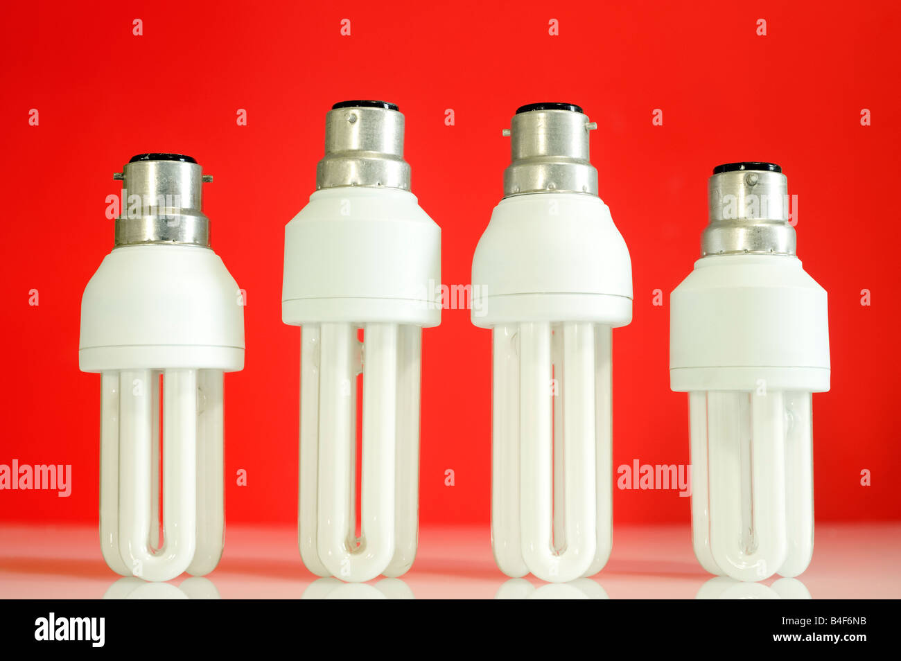 Vier Energiesparlampen Stockfoto