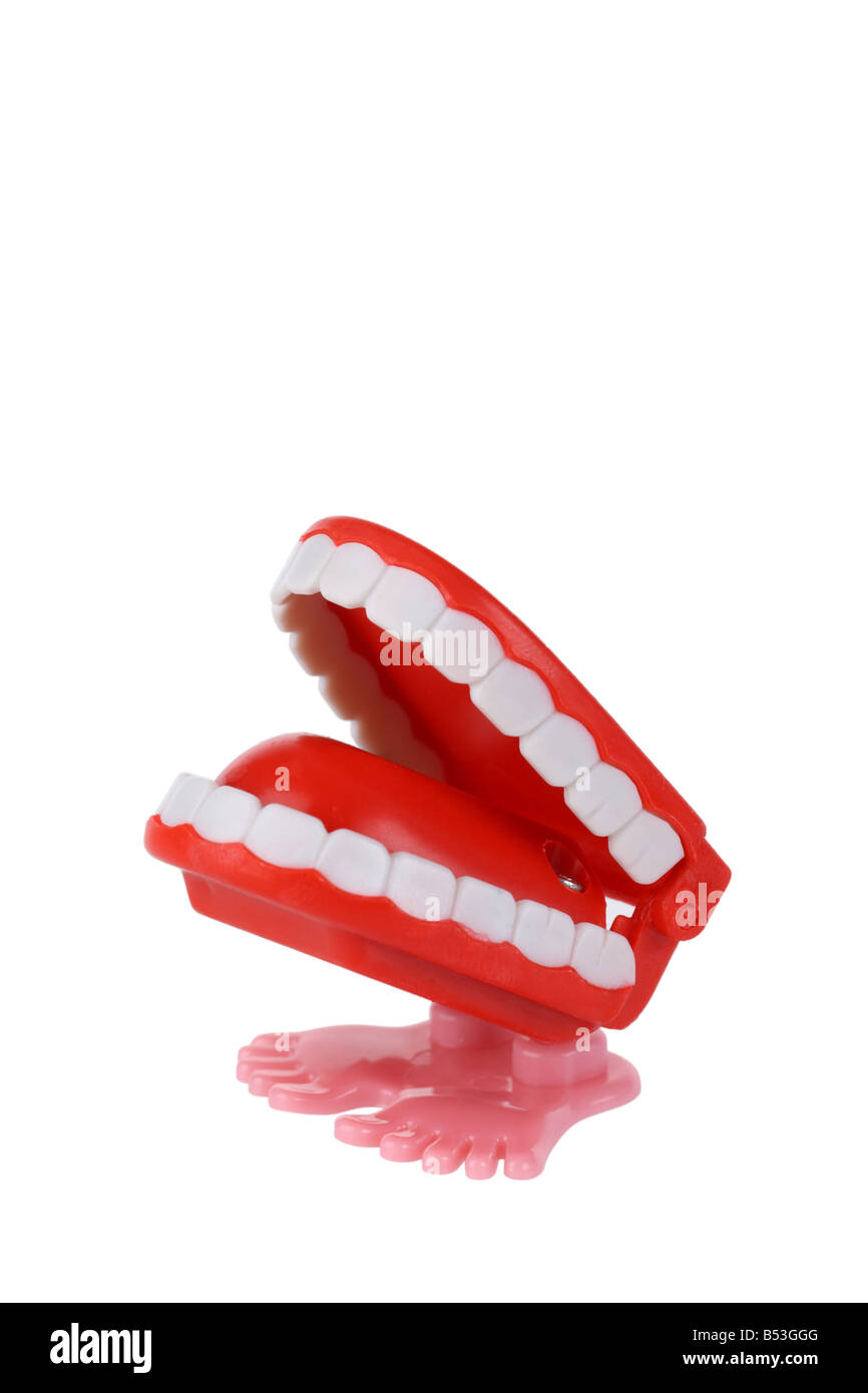 Wind-up Klappern Zähne Spielzeug Ausschnitt isoliert auf weißem Hintergrund Stockfoto