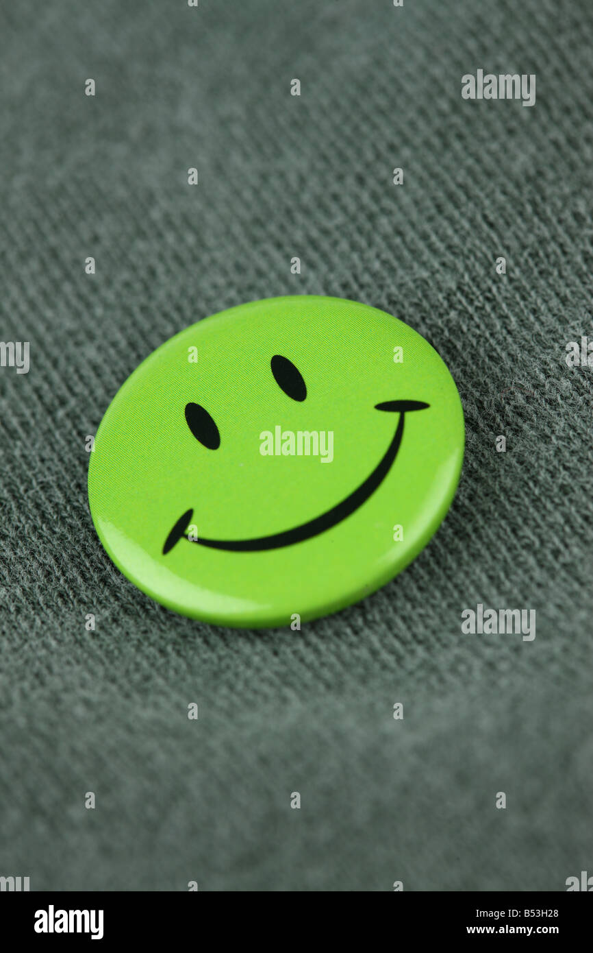 Nahaufnahme eines grünen Smiley-Gesicht-pin Stockfoto