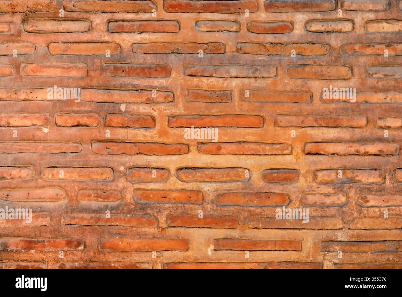 ein Ansient Mauerwerk Wand in der Farbe orange Stockfoto