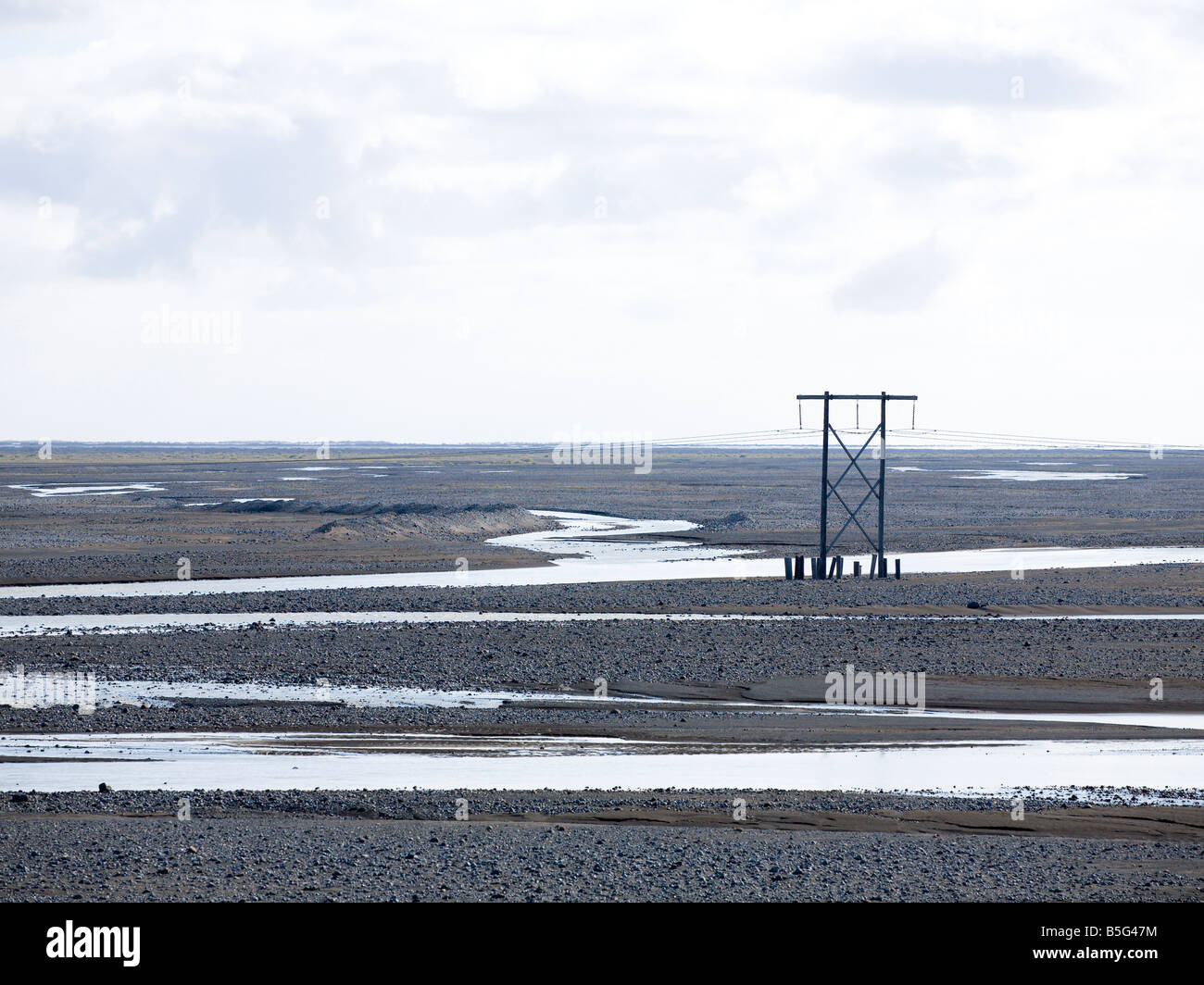 Powerlines, überqueren Skeiðarársandur glazialen Flussaue Suðurland Island Stockfoto