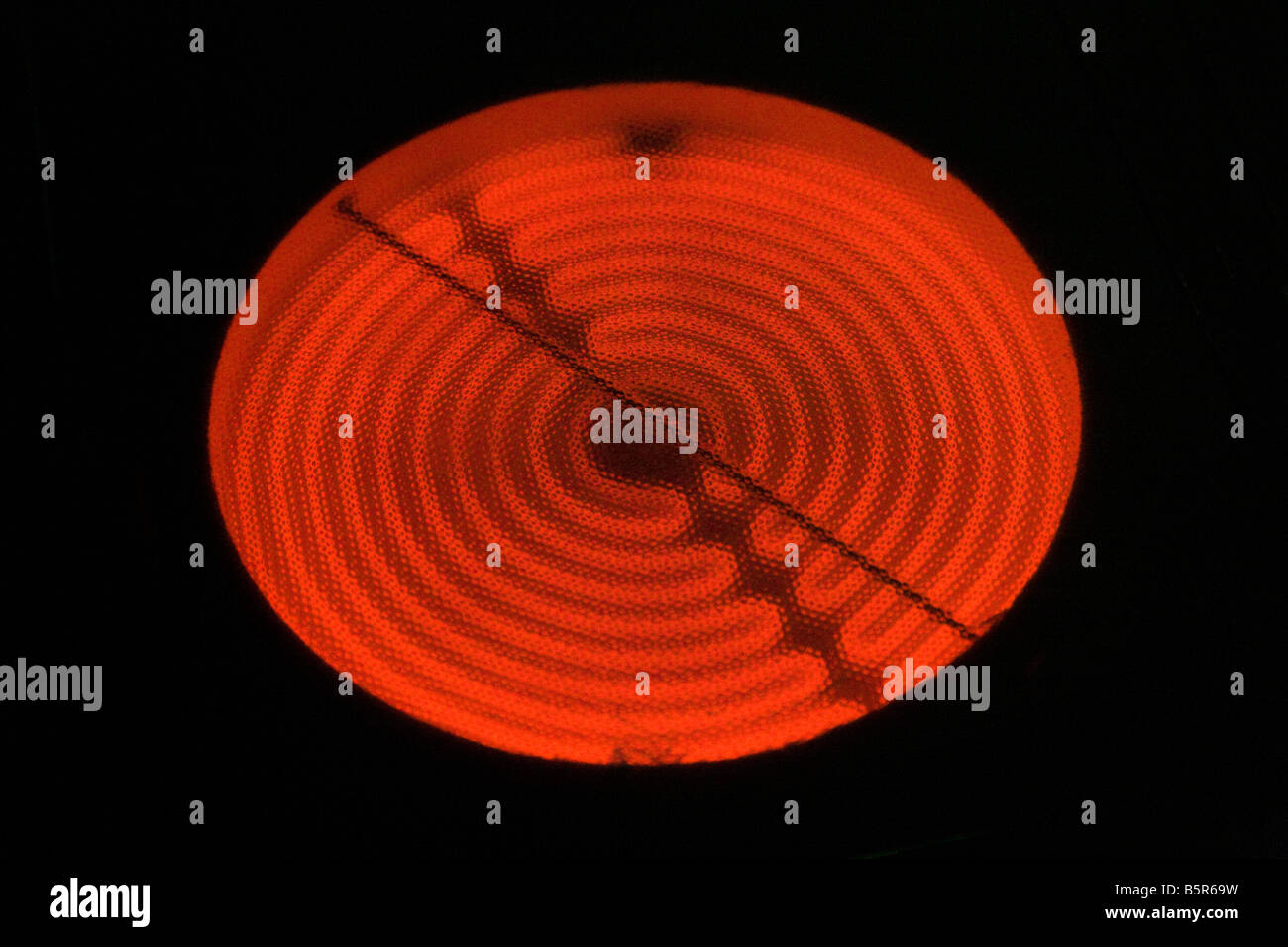 Nahaufnahme von einem glühenden glühende Elektroherd Kochen Element. Stockfoto