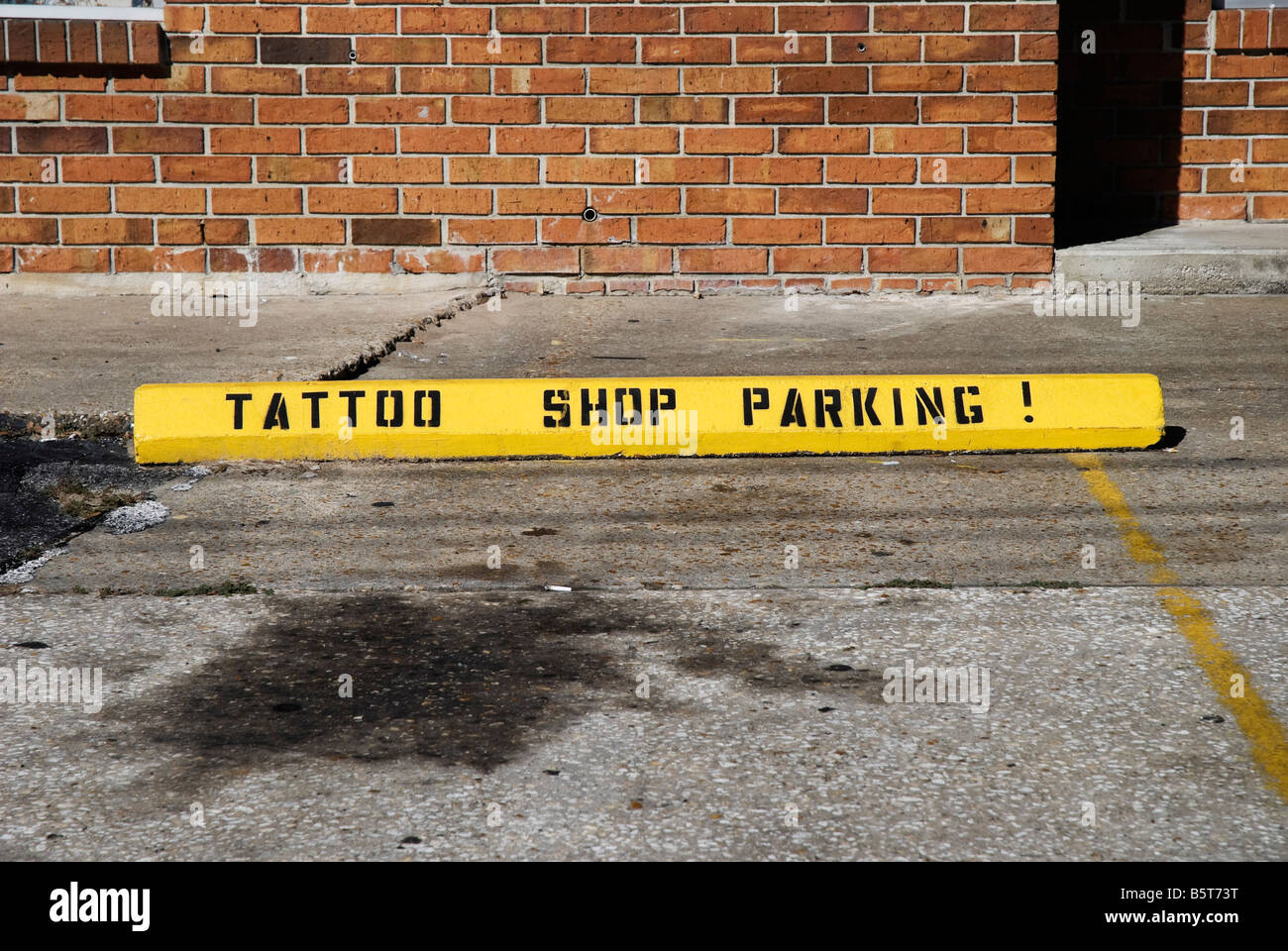 Parkplatz Bezeichnung für Tattoo-shop Stockfoto