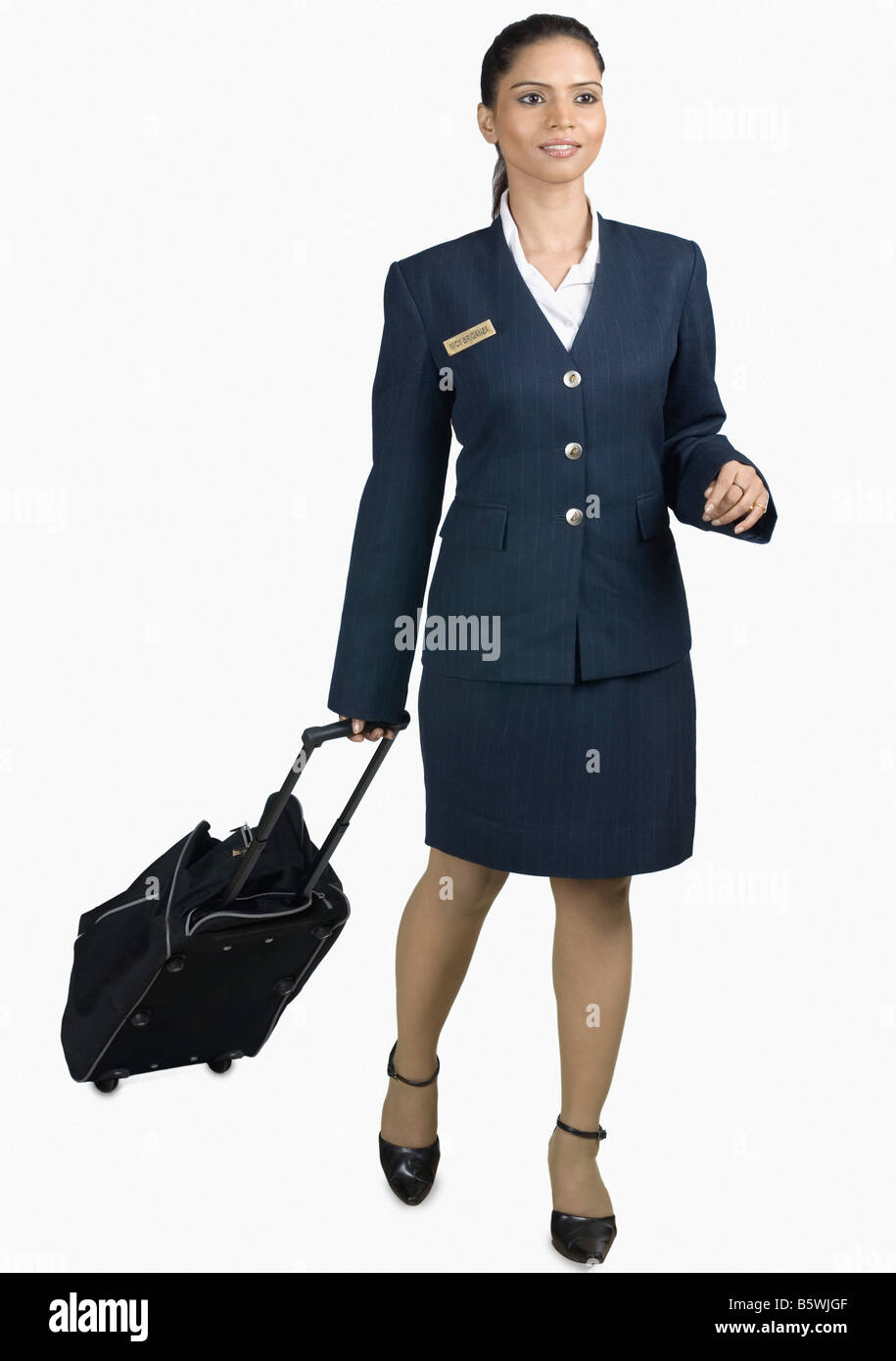 Stewardess mit ihrem Gepäck Stockfoto