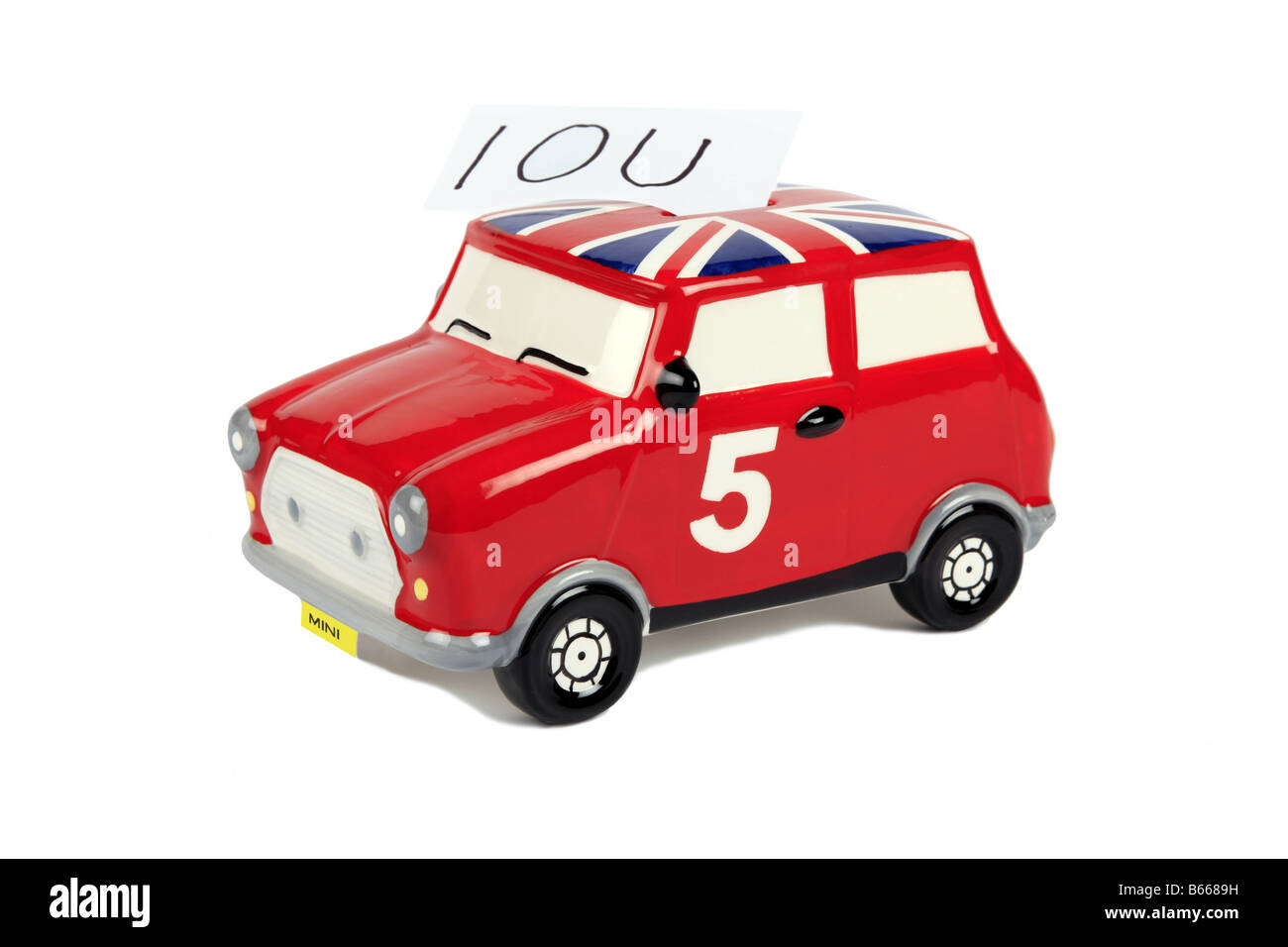 Ein British Leyland Red Mini Sparschwein mit einem Schuldschein Stockfoto