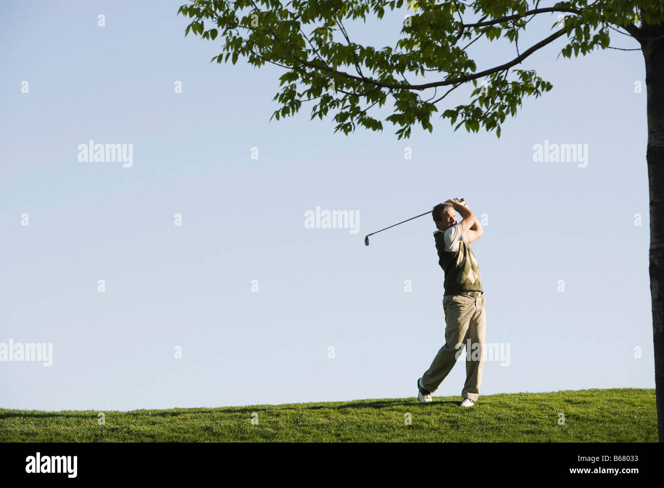 Mann, Golfen Stockfoto