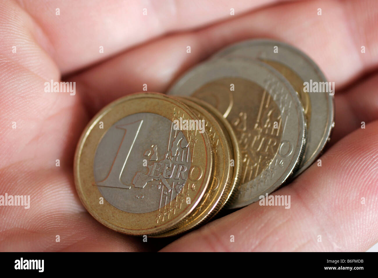 Euro-Münzen in der hand Stockfoto