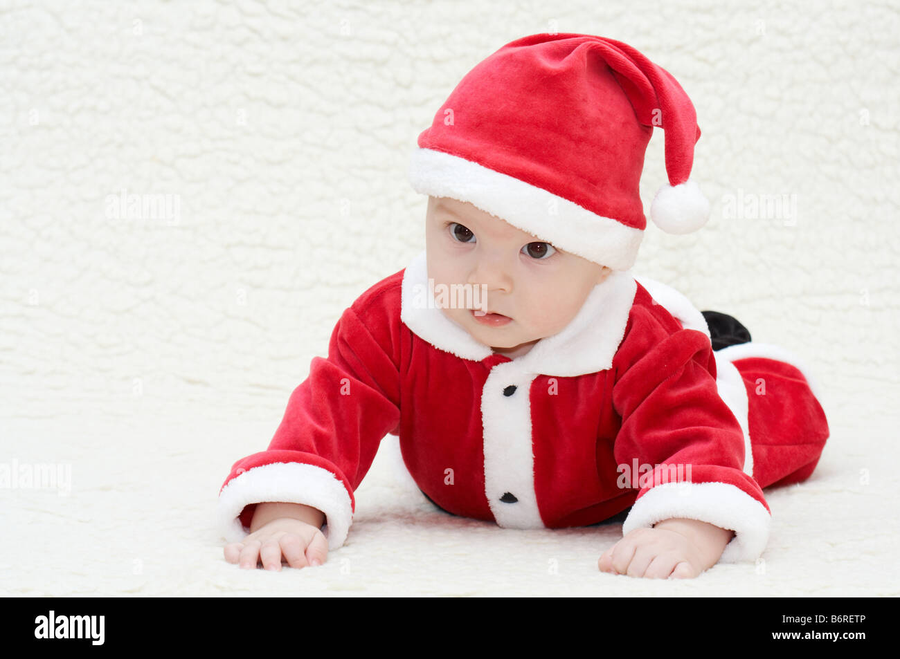 Baby Weihnachtsmann Anzug Stockfoto