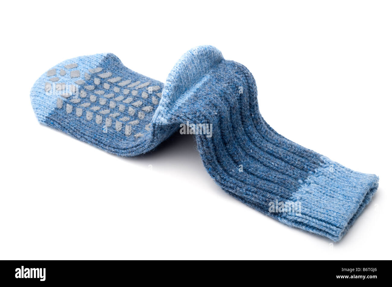 Gestrickte Ferse in ein blauer wollene Pantoffel Socken Stockfoto