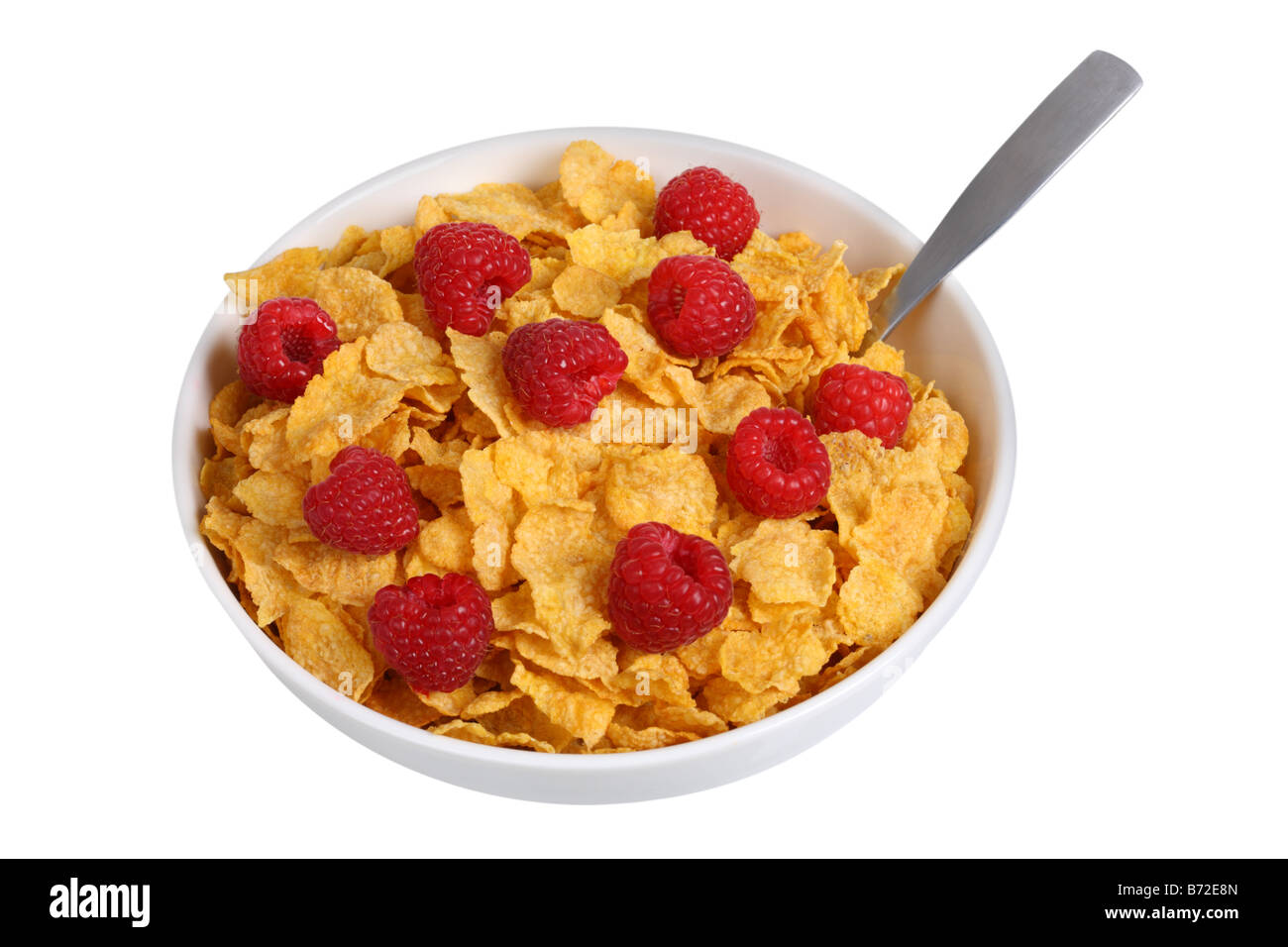 Schüssel mit Cornflakes mit Himbeeren schneiden Sie auf weißem Hintergrund Stockfoto