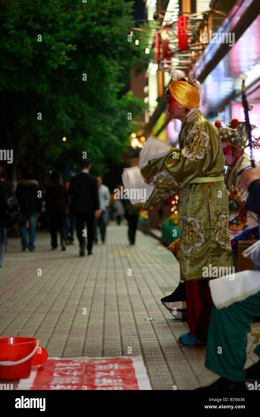 elegante chinesische Bettler Durring globale Krise Stockfoto