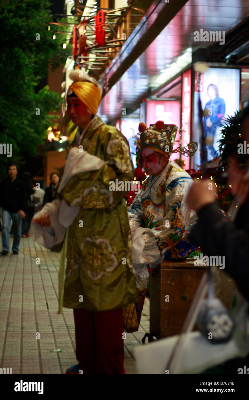 elegante chinesische Bettler Durring globale Krise Stockfoto