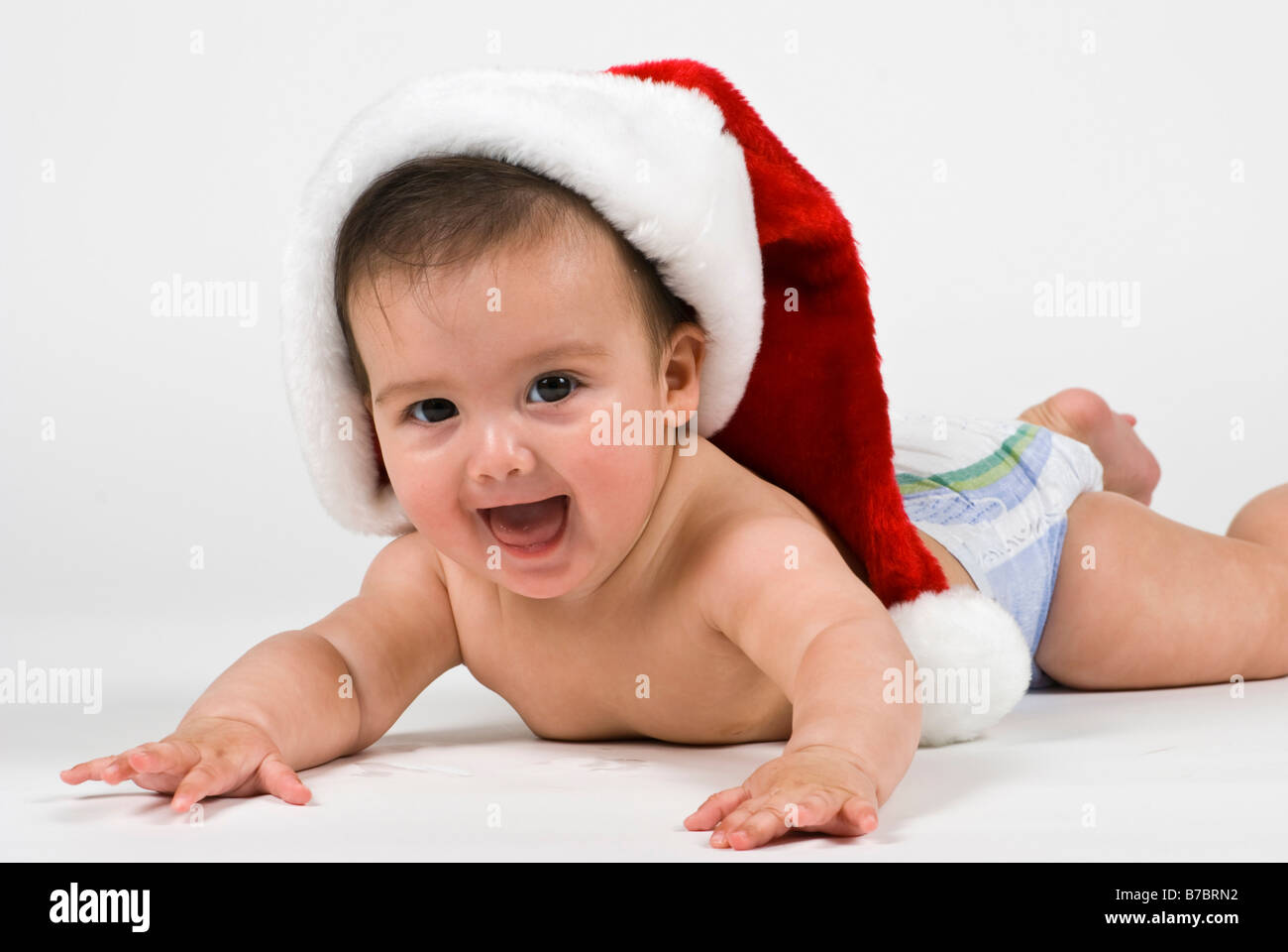 Eine entzückende kleines Mädchen tragen eine Weihnachtsmütze Stockfoto