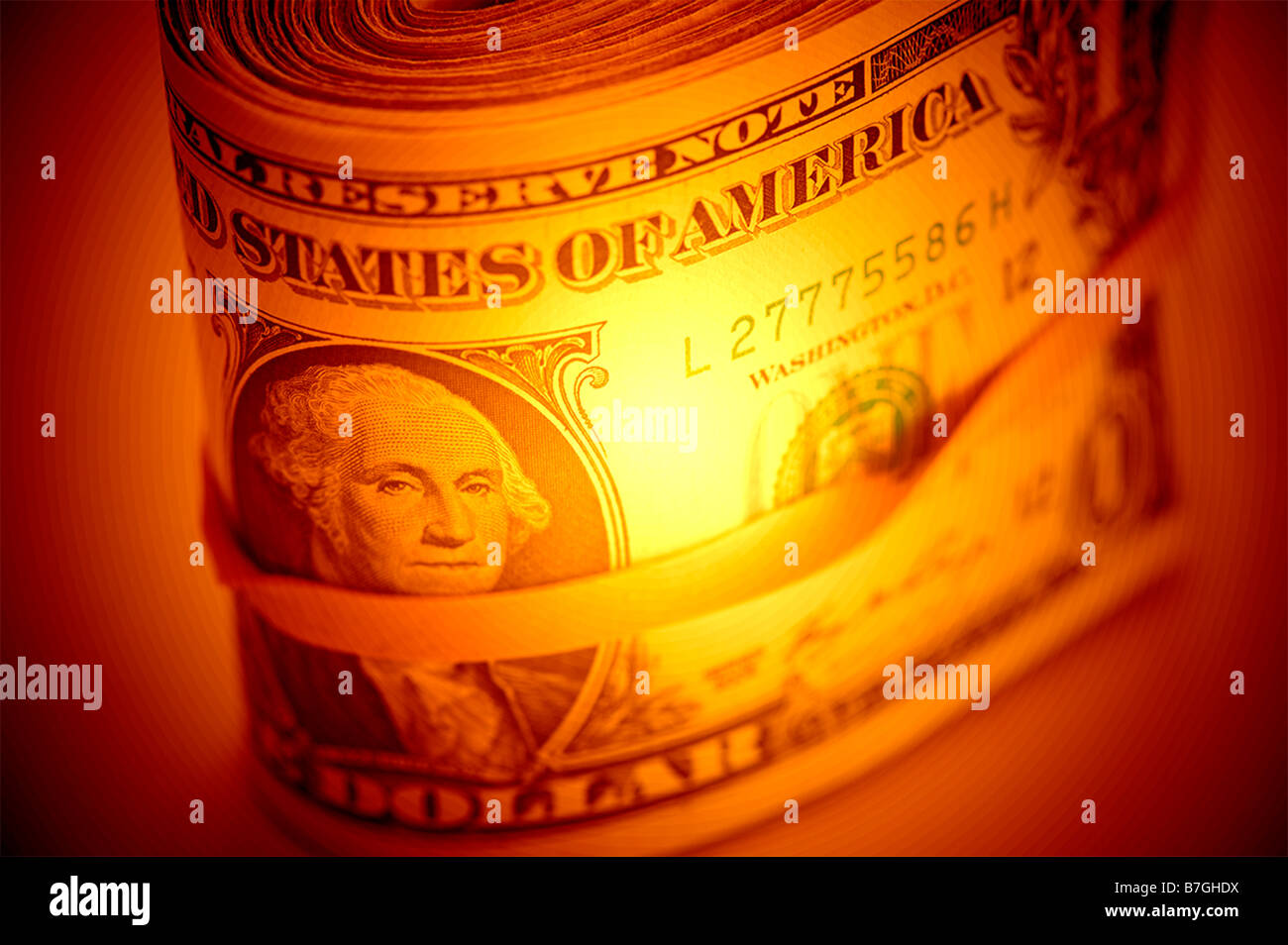 Computer erweiterte Rolle von einem Dollar Rechnungen uns im Gummiband Stockfoto