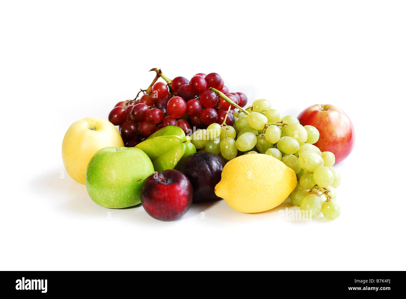 Verschiedene Früchte auf weißem Hintergrund Stockfoto