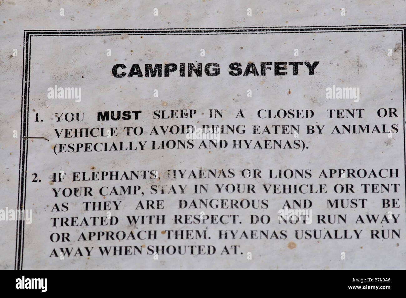Warnschild Savuti Camp site Stockfoto