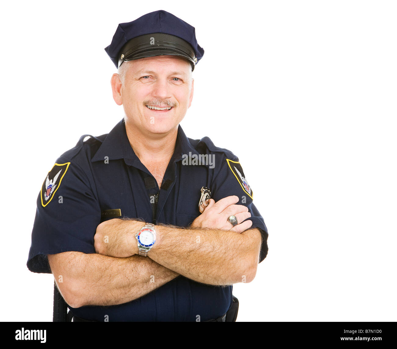 Schöne Reife Polizist lächelnd in seiner einheitlichen Isolated on white Stockfoto