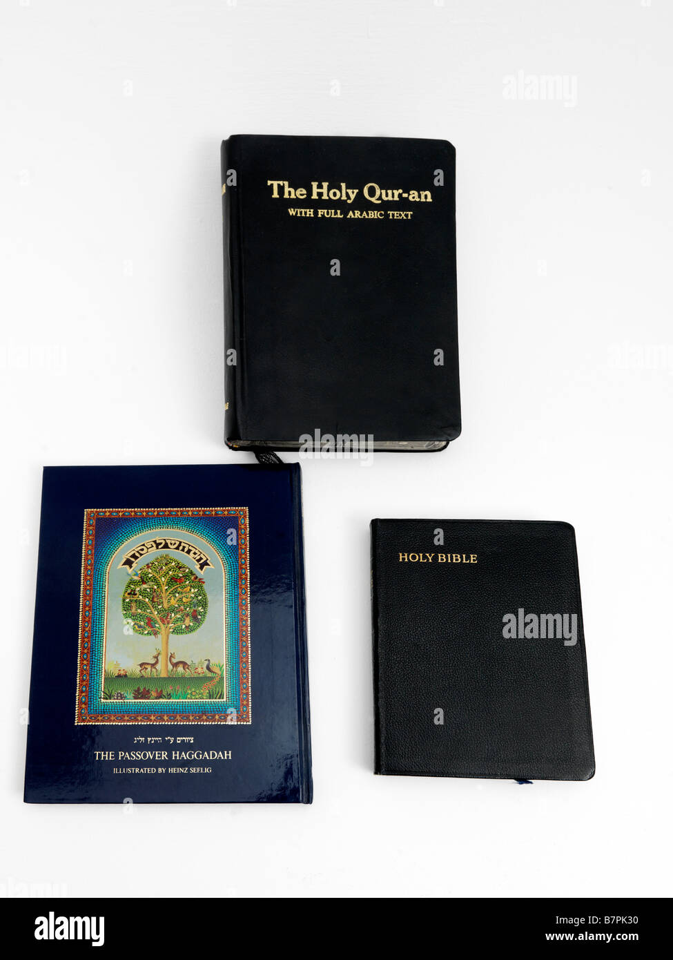 Heilige Bücher-Bibel-Koran und Haggada Stockfoto