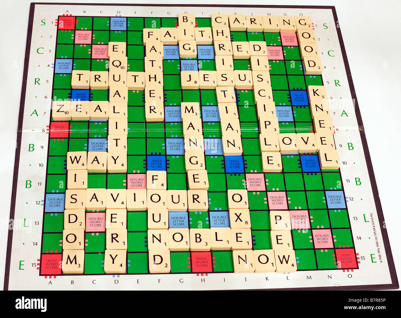 Scrabble-Brett gefüllt mit Worten zu einem christlichen Thema Stockfoto