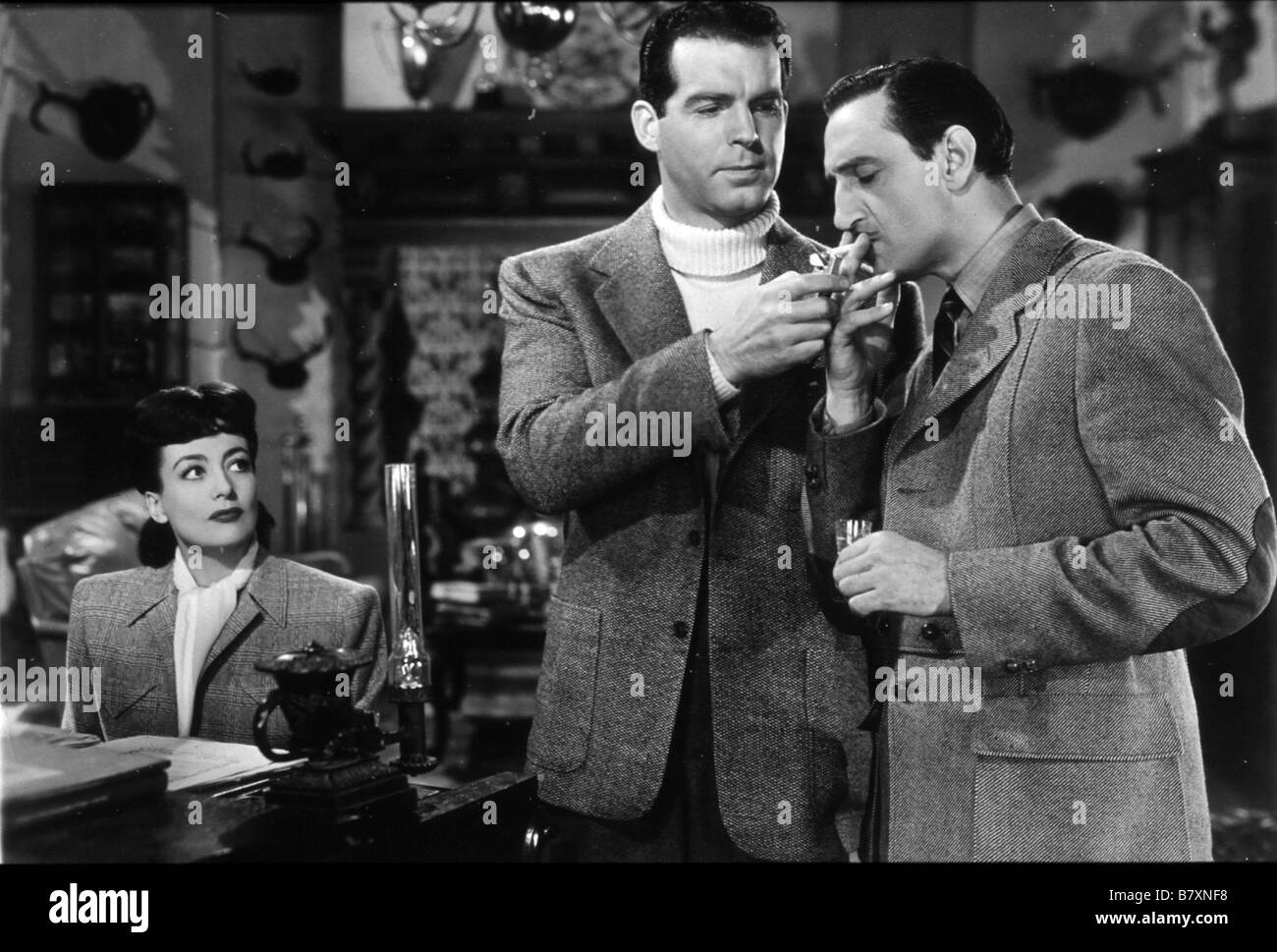 Un espion ein disparu über jeden Verdacht Jahr: 1943 USA Basil Rathbone, Fred MacMurray, Joan Crawford Regisseur: Richard Thorpe Stockfoto