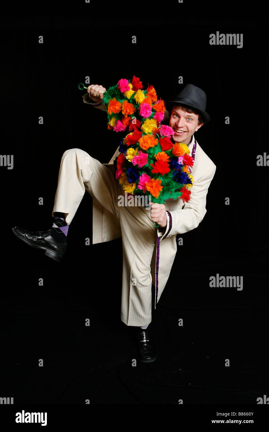Ajan der magischen Clown mit der Gabe der Blumen Stockfoto