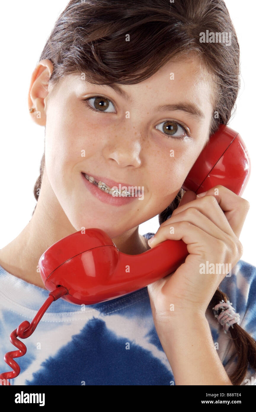 Junge Mädchen sprechen am Telefon ein weißer Hintergrund Stockfoto