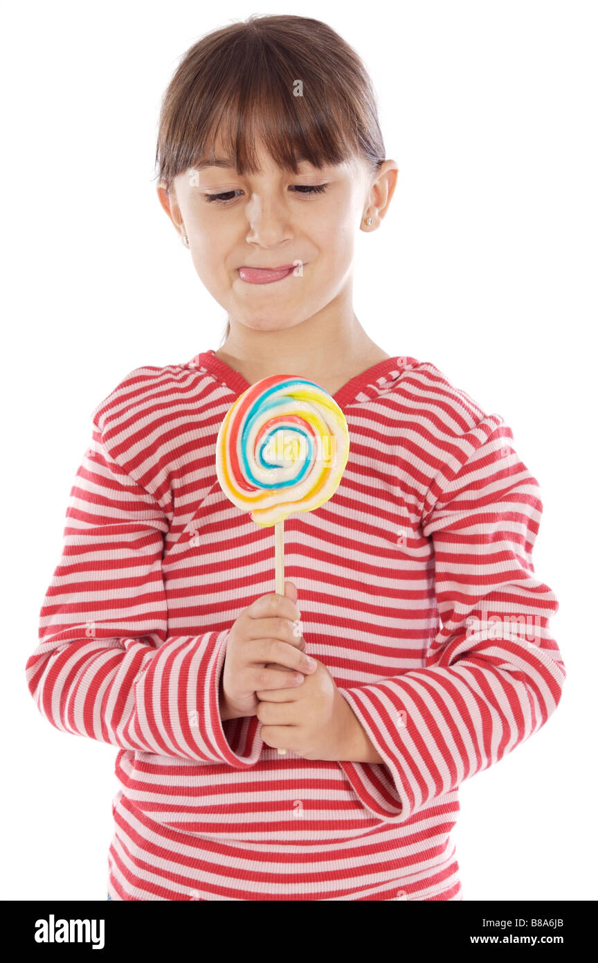 Süße junge Mädchen mit einem Lutscher auf weißem Hintergrund Stockfoto