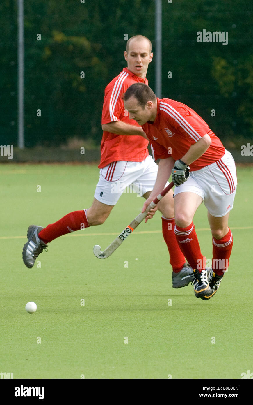 Männer spielen Hockey Stockfoto
