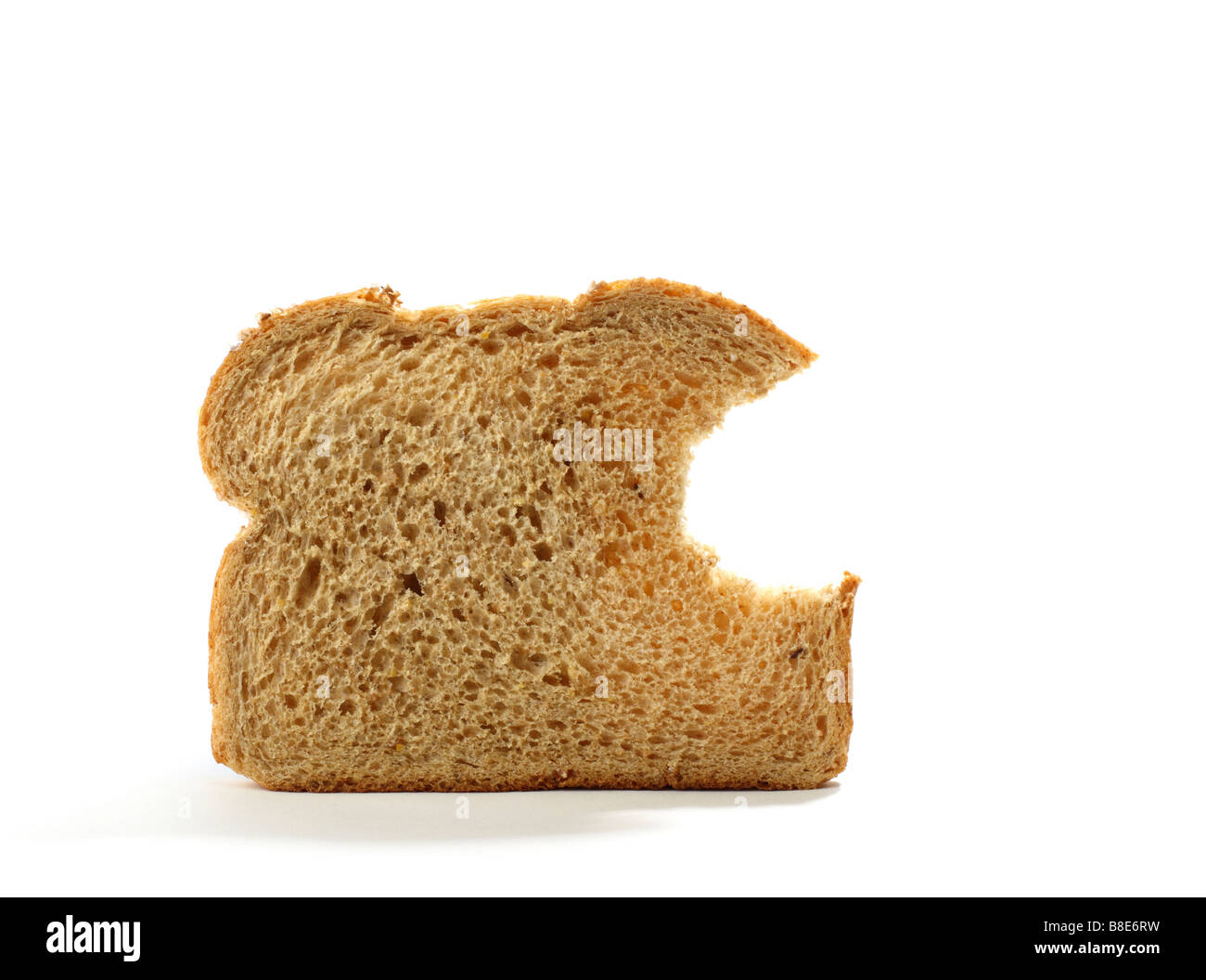 Stück Brot mit Biss herausgenommen Stockfoto