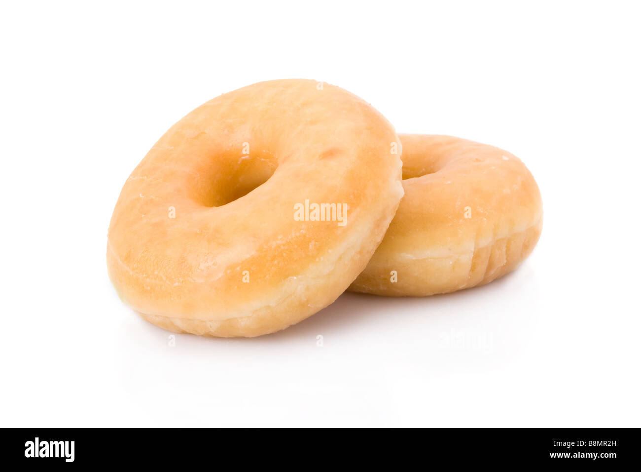 Zwei Donuts oder Krapfen aufgetürmt isoliert auf weiss Stockfoto