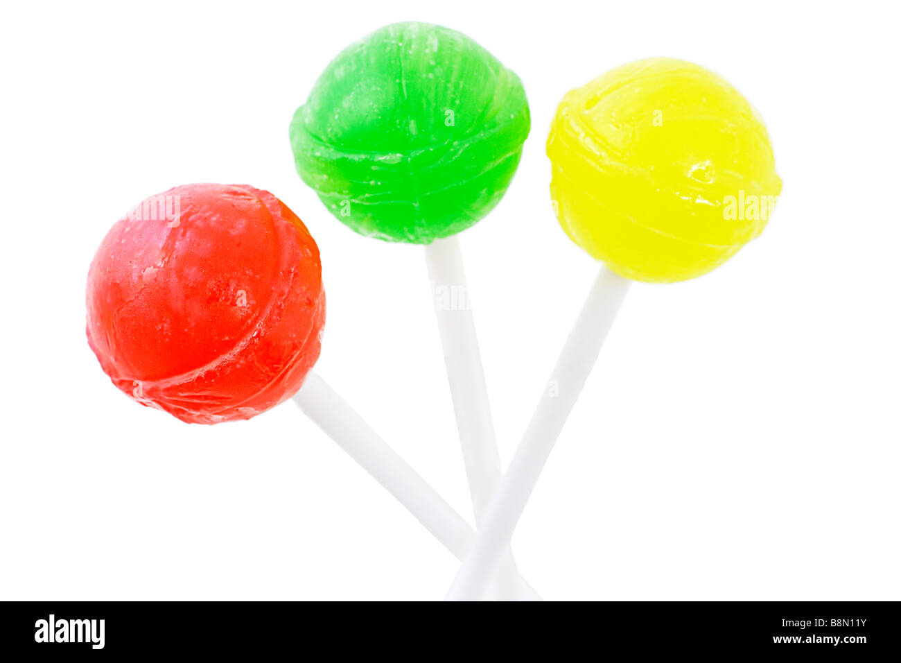 Drei bunte Lutscher auf weißem Hintergrund Stockfoto Drei bunte Lutscher auf weißem Hintergrund Stockfoto