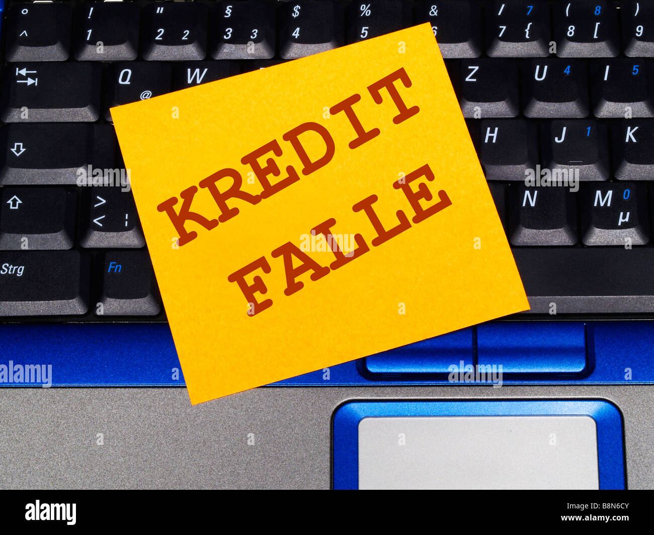 Memo-Hinweis auf Notebook, Kredit-Falle Stockfoto