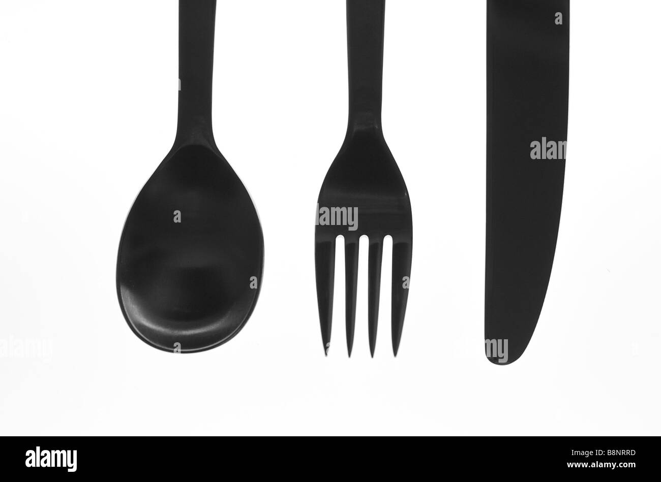 Lebendige Silhouette Bild von Essgeschirr (Löffel, Gabel und Messer) mit weißem Hintergrund Stockfoto