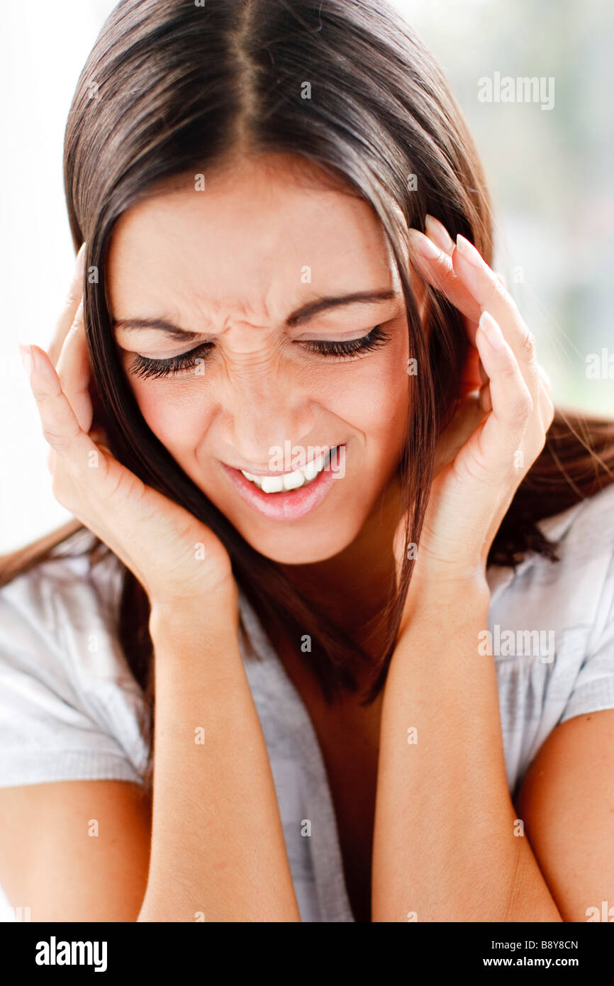 Frau mit Kopfschmerzen Stockfoto