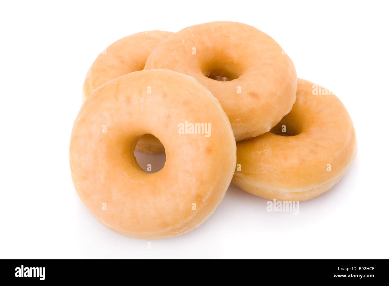 Drei Berliner oder Krapfen aufgetürmt isoliert auf weiss Stockfoto