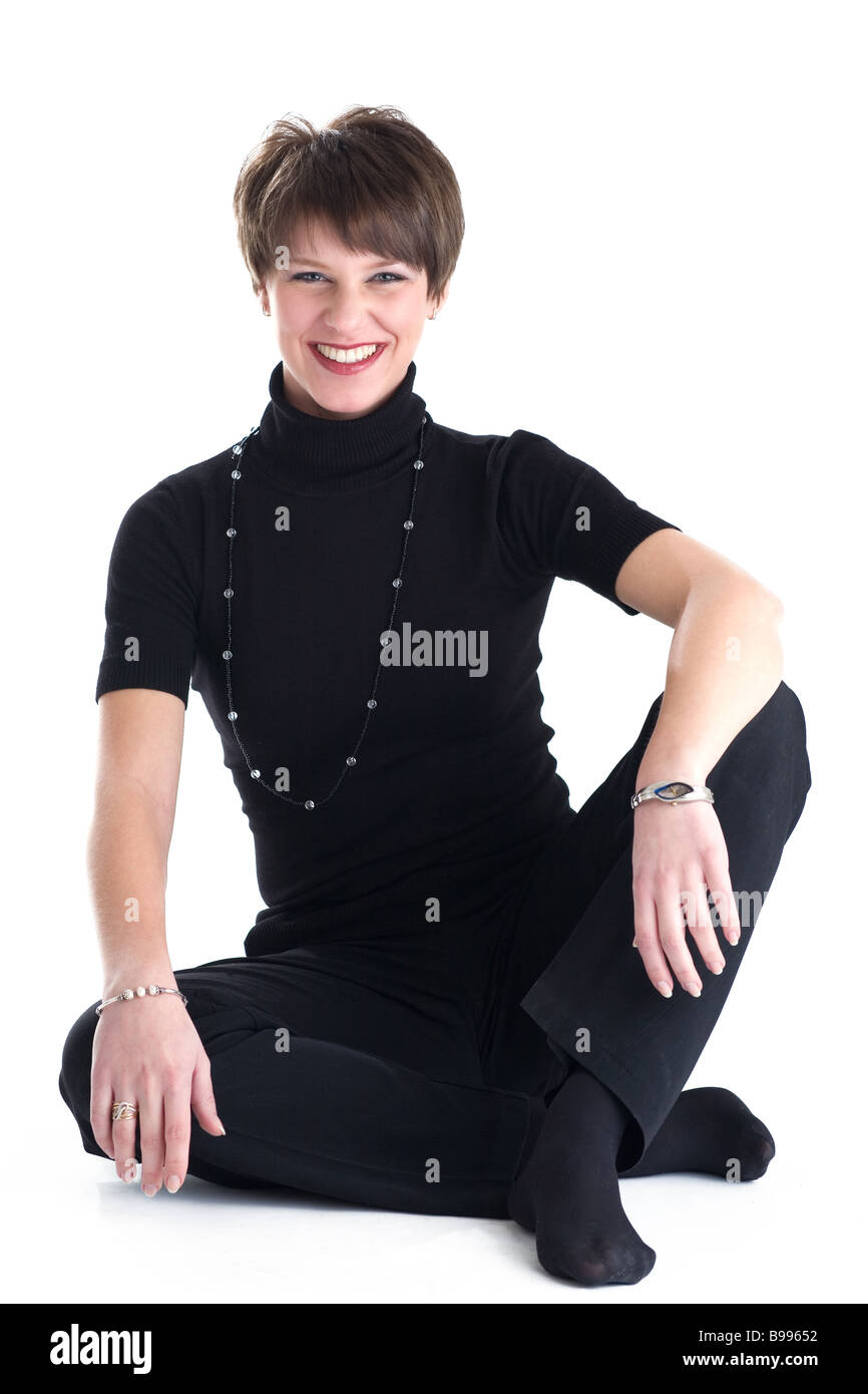 Lächelnde Frauen in schwarzen Kostüm Stockfoto