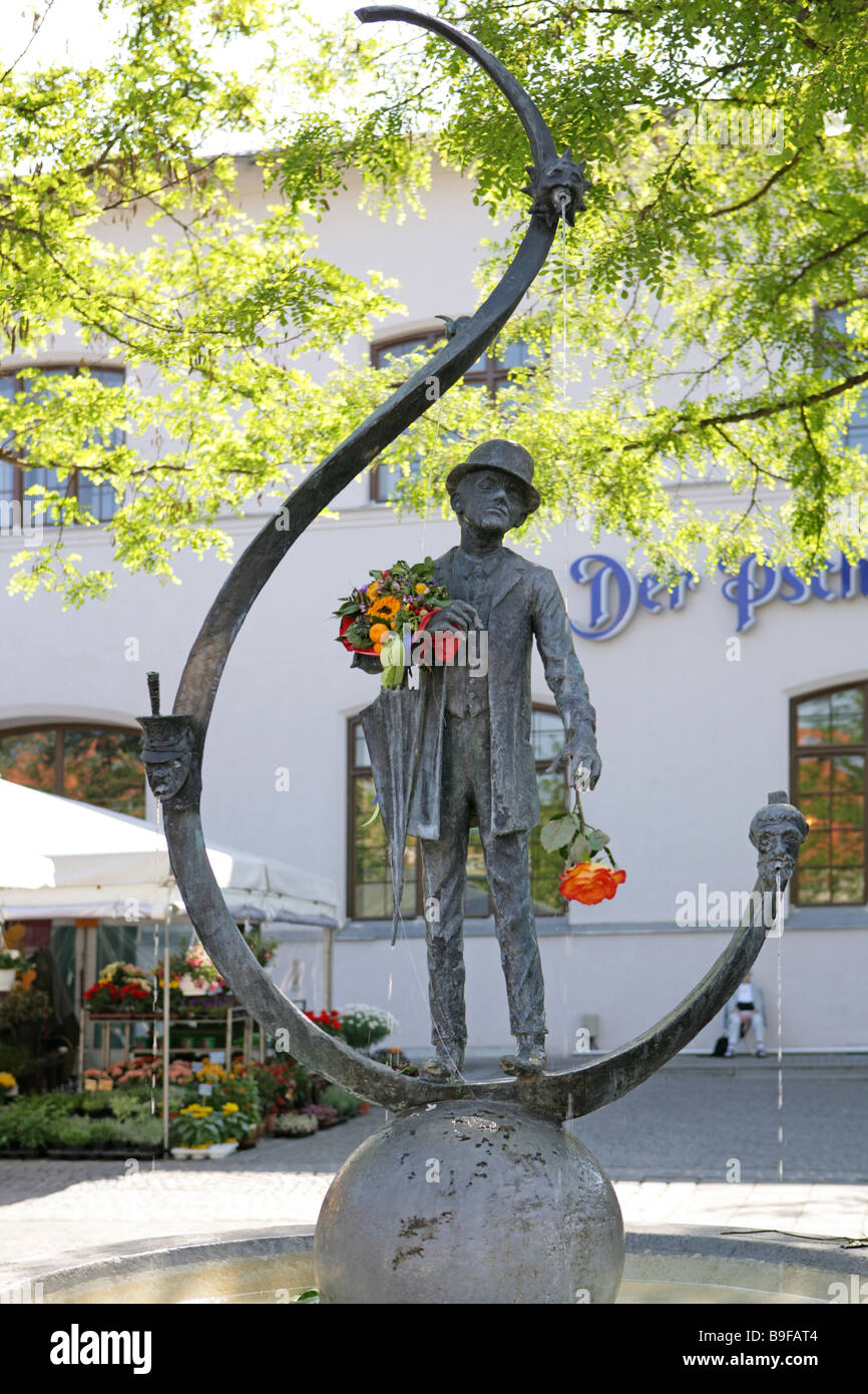 Deutschland Bayern München Karl-Valentin-Brunnen Viktualienmarkt Bayern bekannt berühmte Skulptur Bildhauer-Kunst-Blumenstrauß Stockfoto
