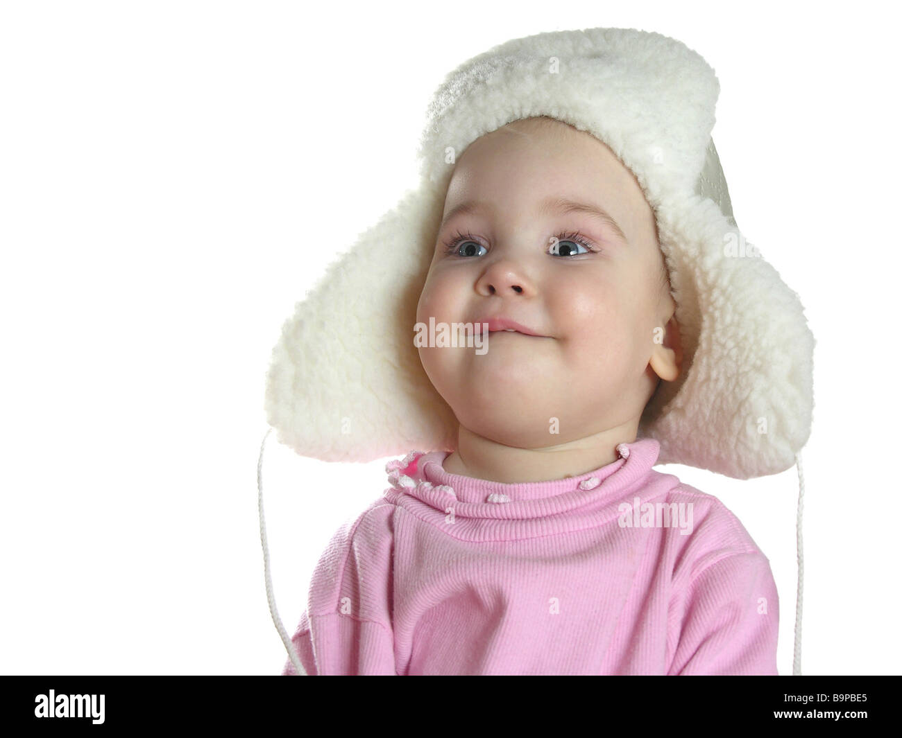 Baby mit Mütze mit Ohrenklappen Stockfoto
