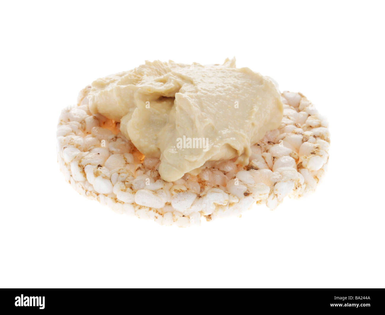 Reiskuchen mit Hummus Stockfoto