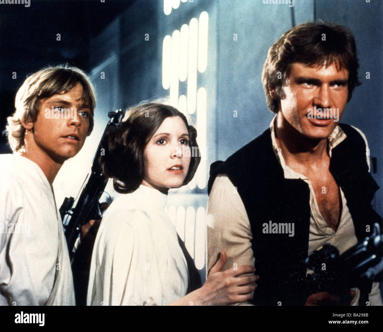 STAR WARS: EPISODE IV – eine neue Hoffnung 1977 TCF film mit von links: Mark Hamill, Carrie Fisher und Harrison Fjord Stockfoto