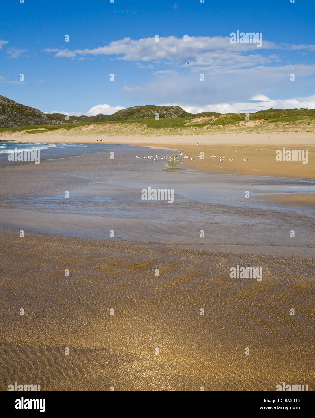 Flut an einem Sandstrand, Kiloran Bay, Insel Colonsay, Schottland Stockfoto