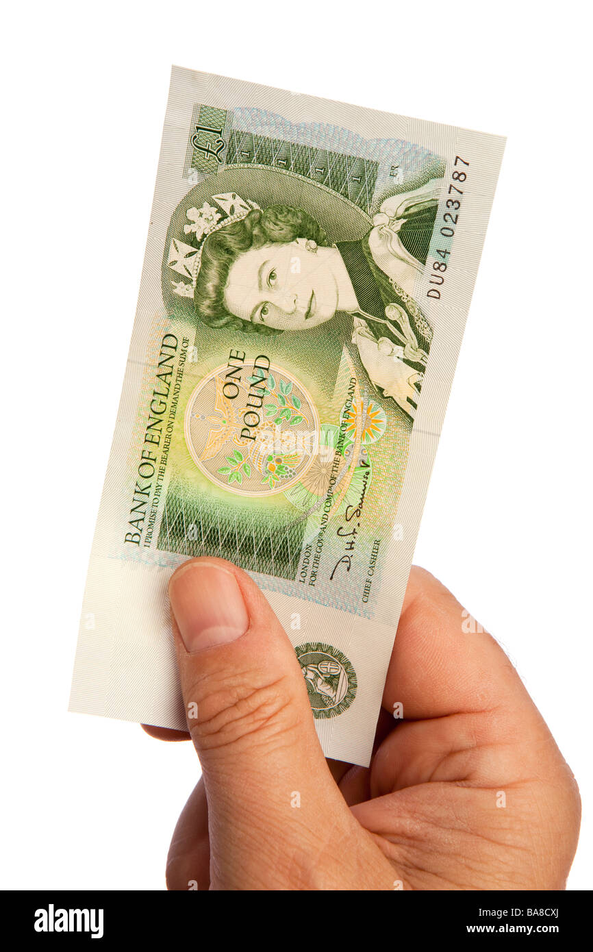 Geld männliche Hand, die alten britischen ein Pfund-banknote Stockfoto
