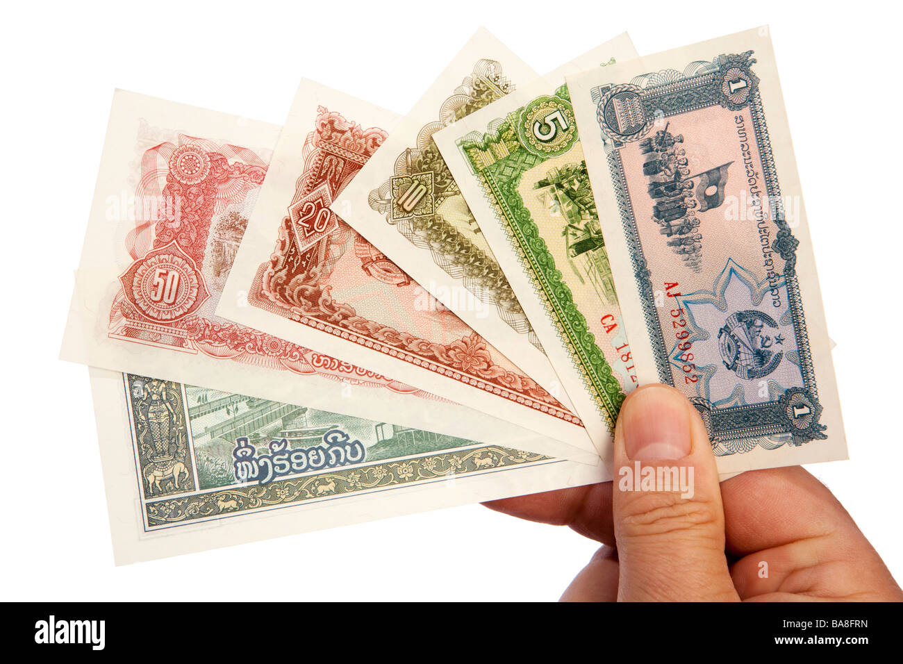 Geld männliche Hand Holding Handvoll niedrig der alten Bezeichnung Lao Währung Stockfoto