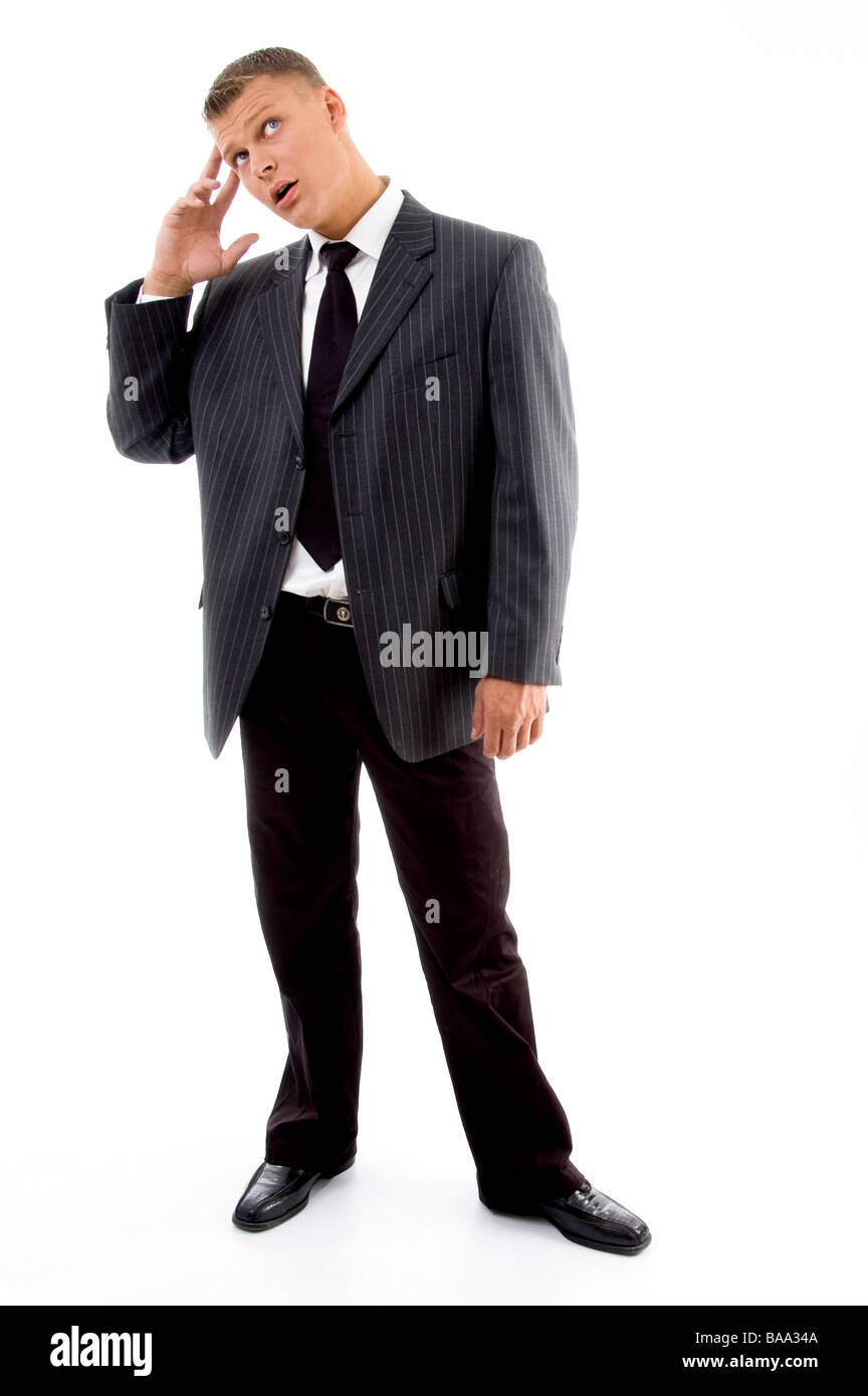 betonte Geschäftsmann in Spannung, die auf der Suche nach oben Stockfoto