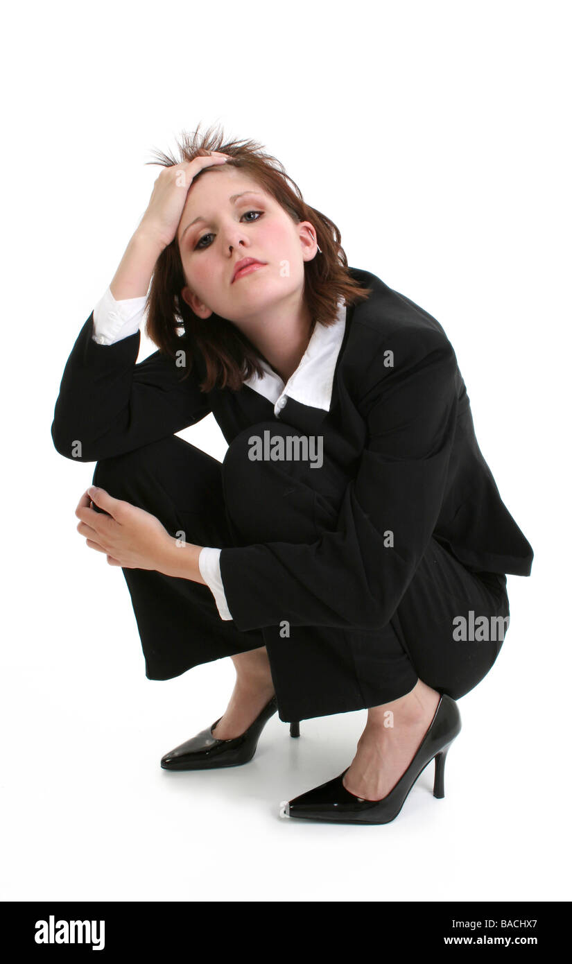 Geschäftsfrau, die mit ihrer Hand in ihr Haar Stockfoto Geschäftsfrau, die mit ihrer Hand in ihr Haar Stockfoto