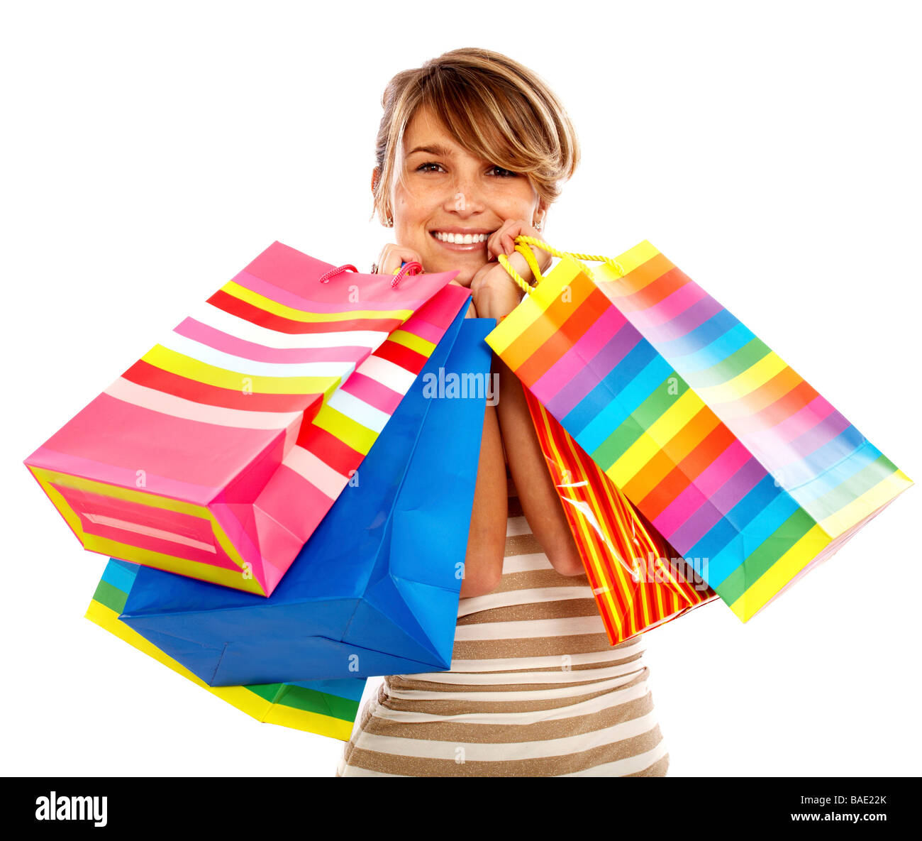 Mädchen lächelnd und Einkaufstaschen isoliert auf einem weißen Hintergrund Stockfoto