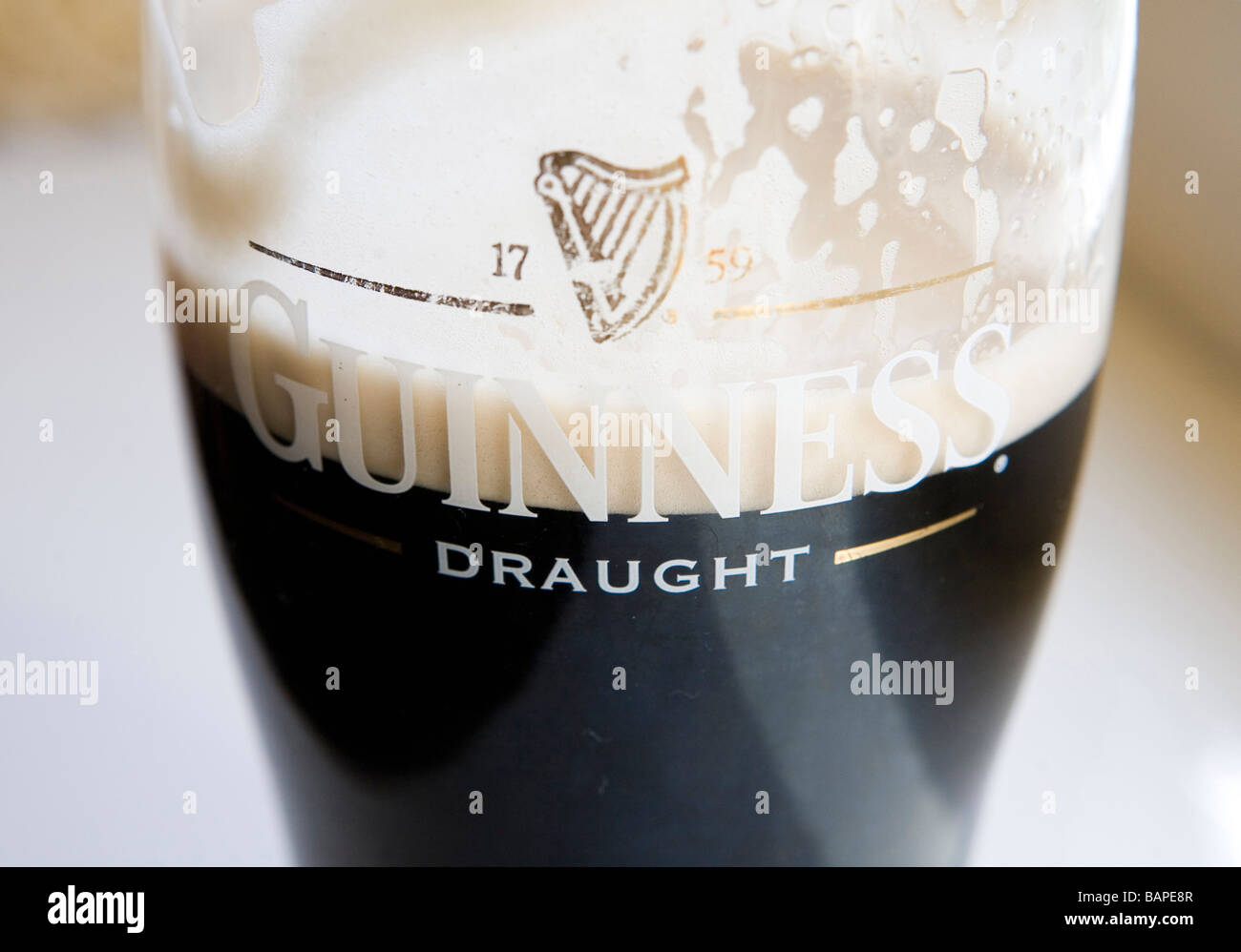 Eine halbe Pint Glas Guinness getrunken Stockfoto