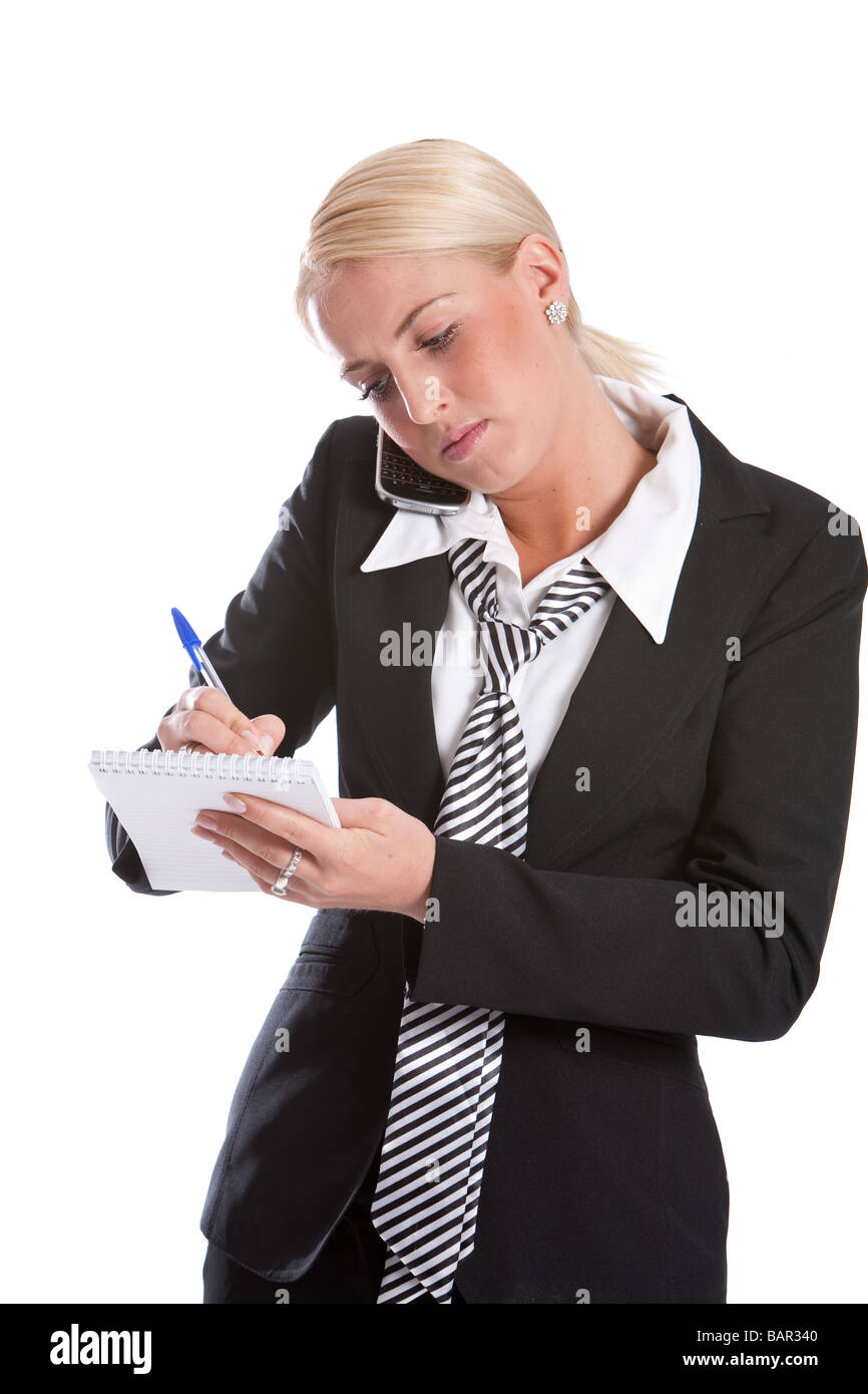 Schöne Geschäftsfrau Notizen während auf dem Handy Stockfoto